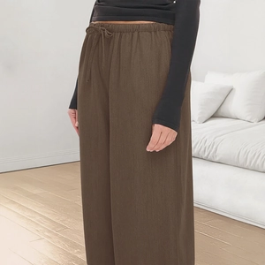 Deep brown wide-leg casual pants with elastic drawstring waist and breathable cotton texture