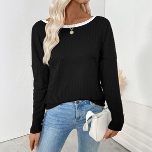 Women's black long sleeve knit top with white contrast crew neck and ribbed texture