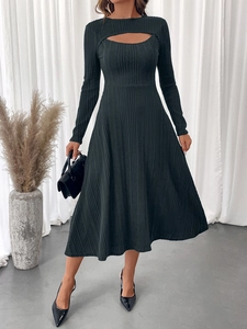 Detail of ribbed knit texture and chest cutout on elegant black long sleeve midi dress