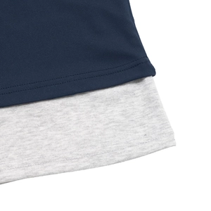 Detail of slim-fit faux two-piece top showing navy blue and grey layered hem stitching