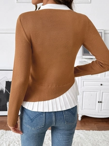 Detail of faux two-piece brown knit sweater featuring pleated hem and ribbed texture