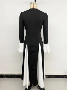Detail view of A-line dress featuring contrast color panels and flared ruffle cuffs