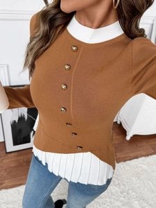 Close-up of caramel knit sweater with gold buttons and white pleated collar detail