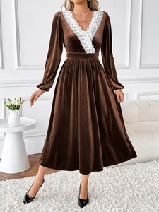 Detail of elegant white lace V-neckline stitching on premium brown velvet long-sleeve dress