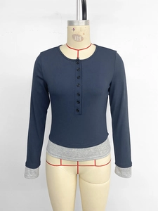 Detail view of navy blue long sleeve Henley shirt with contrast gray layered cuffs