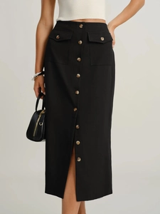 Detail view of black midi skirt featuring decorative buttons and front flap pockets