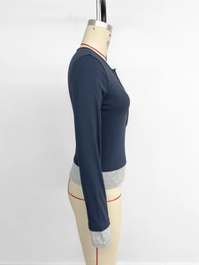 Side view of slim fit long sleeve shirt with contrast grey cuffs and button details