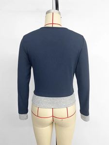 Rear view of slim fit navy blue faux two-piece top with grey patchwork sleeves
