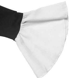 Detail view of contrast black and white bell sleeve with elegant flared ruffle cuffs