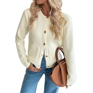 Women's cream knit cardigan featuring gold buttons and dual pockets on white background