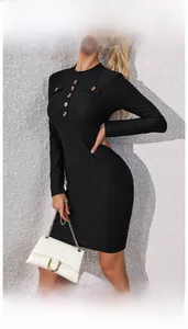 Detail of black knit dress featuring vintage amber buttons and textured fabric