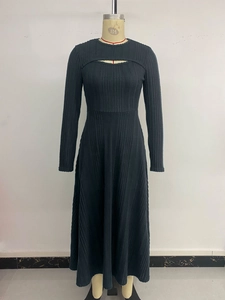 Detailed view of dark grey rib-knit texture and elegant cutout on the long sleeve maxi dress