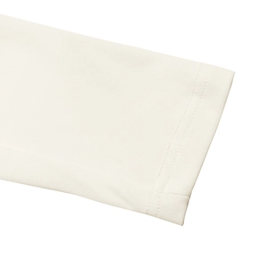 Close-up of white long sleeve cuff showing double-needle stitching and knit fabric texture
