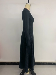Detailed vertical ribbed texture of a slim-fit dark gray knitted maxi dress