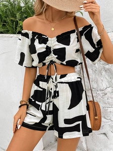 Women's summer two-piece set with off-shoulder crop top and matching abstract print shorts