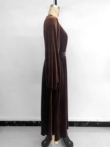 Detailed view of brown velvet maxi dress featuring elegant lace V-neck and lantern sleeves