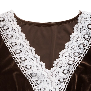 Detailed close-up of V-neckline with delicate white lace patchwork on brown velvet dress