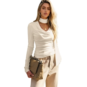 Elegant cream pleated long sleeve top with draped neckline and slim fit design