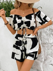 Macro view of black and white abstract print on summer crop top and high waist shorts