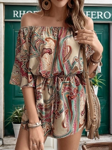 Detail of bohemian paisley print romper with off-the-shoulder neckline and drawstring waist