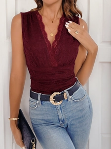 Detail of burgundy lace sleeveless bodysuit with V-neckline and intricate floral patterns