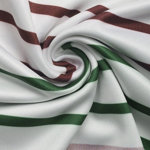 Detailed close-up of textured knit fabric featuring colorful horizontal stripes on the shirt