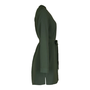 Detailed side view of dark green V-neck dress featuring waist tie and elegant side slit hem