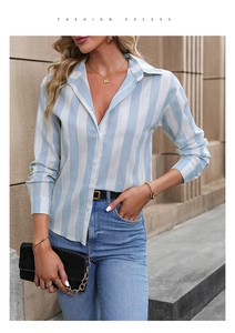 Detail of blue and white vertical striped long sleeve button-up shirt with a lapel collar