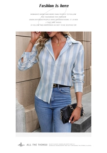 Detail of blue and white striped long sleeve button-up shirt with premium woven texture