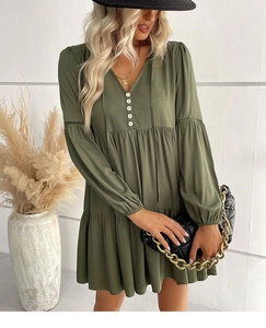 Detail of army green V-neck dress with buttons and elastic cuffs for a bohemian look