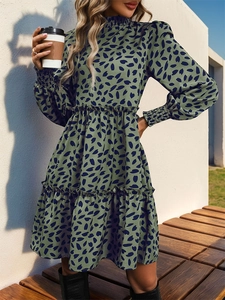 Close-up of smocked high neck and long sleeves on a dark green leopard floral dress