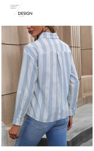 Detail of blue and white striped long-sleeve shirt with back pleat and classic collar