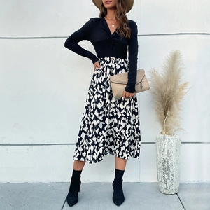 Ensemble haut noir à col en V torsadé et jupe midi à imprimé abstrait pour femme