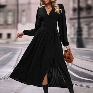 Detail of elegant black V-neck pleated maxi dress with waist wrap and front slit design