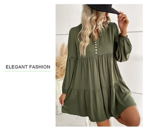 Detail of olive green babydoll dress featuring V-neck buttons and tiered ruffle hem