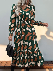 Detail of V-neck maxi dress with geometric print and drawstring waist on a model