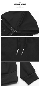 Détails de dentelle de capuche, embouts métalliques et poignets côtelés sur sweat noir
