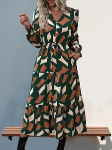 Detail of the V-neck design and drawstring waist on the geometric maxi dress