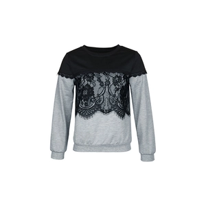 Detail of floral lace patchwork and contrast color stitching on long sleeve sweatshirt