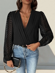 Close-up of V-neck bodysuit featuring pleated front and sheer chevron textured sleeves