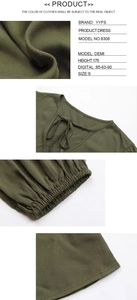 Macro detail of dark green dress showing twill fabric texture and tied neckline design