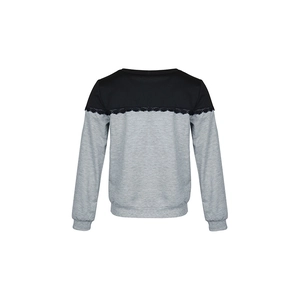 Detail of grey and black color-block sweatshirt featuring delicate lace trim seams