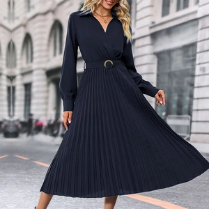 Close-up of navy blue pleated long-sleeve maxi dress with waist belt and metal buckle