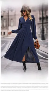 Detail of navy blue V-neck pleated maxi dress with waist belt and high front slit