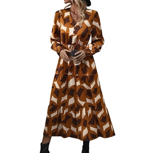 Elegant V-neck maxi dress with geometric print, drawstring waist, and tiered skirt details