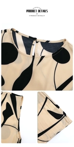 Détails du col rond et de l'imprimé géométrique noir sur cette robe plissée beige