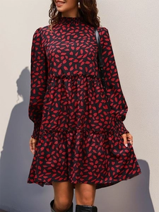Detail view of the elegant tiered ruffle hem and floral print on long sleeve dress