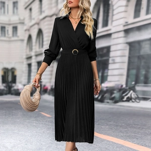 Close-up of black long-sleeved pleated dress featuring a V-neck and belted waist detail