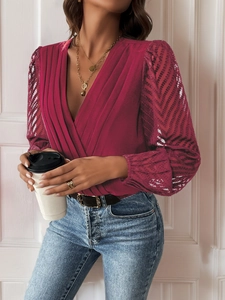 Close-up of elegant V-neck wine red bodysuit with sheer lace sleeves and pleated texture
