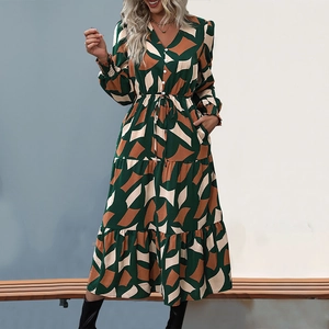 Elegant V-neck long sleeve dress with geometric patterns and tiered skirt detail